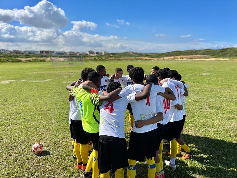 Shosholoza team huddled together before a match